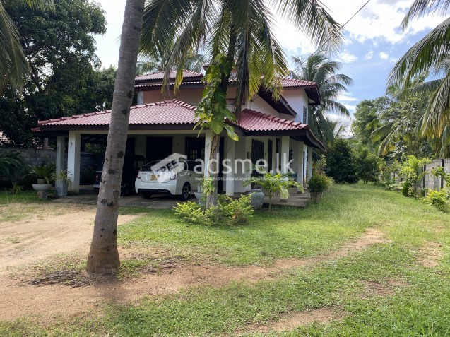 Two story house with land for sale.
