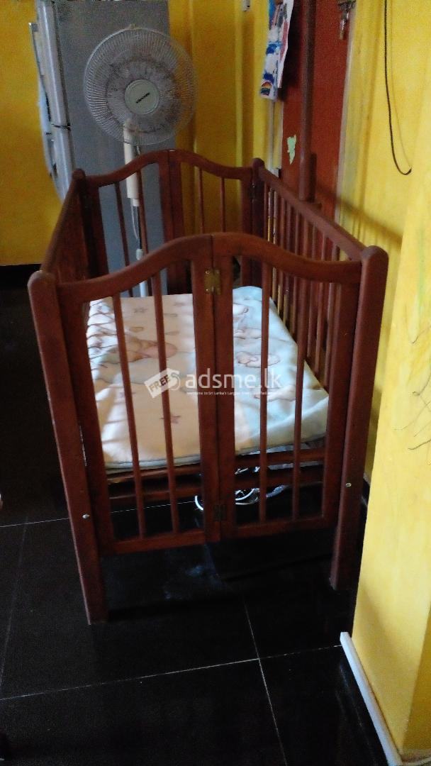 Used wooden baby cot for sale