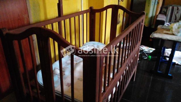 Used wooden baby cot for sale