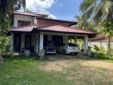 Two story house with land for sale.