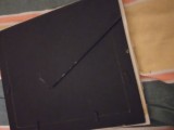 Ceramic front surrounding photo frame.